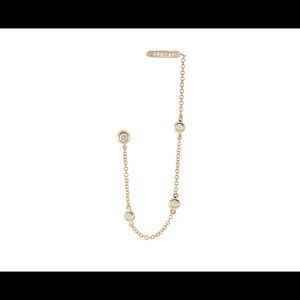 14k gold and diamond earring with chain and cuff.